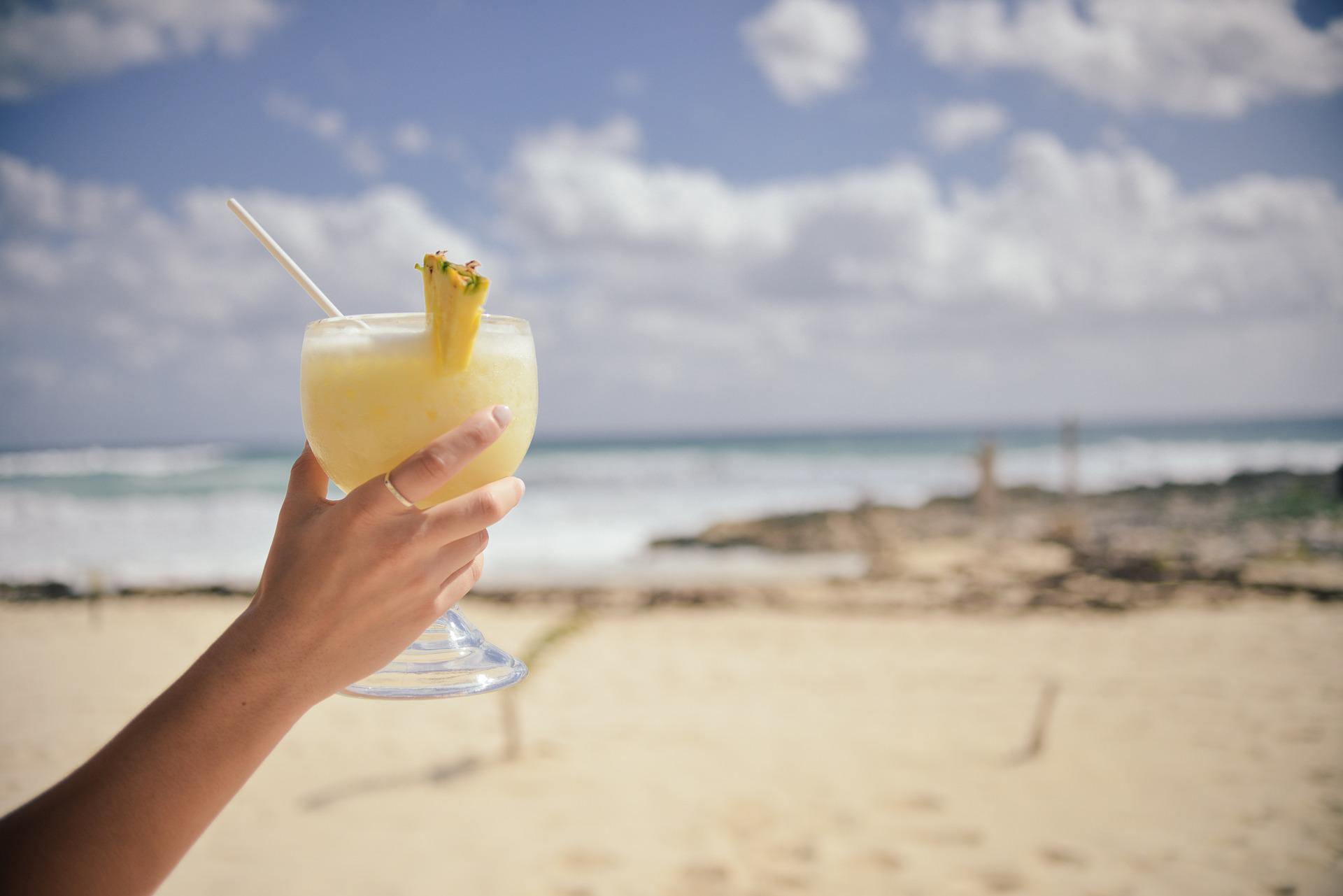 A Hispanic girl at the beach on a summer day enjoying the day