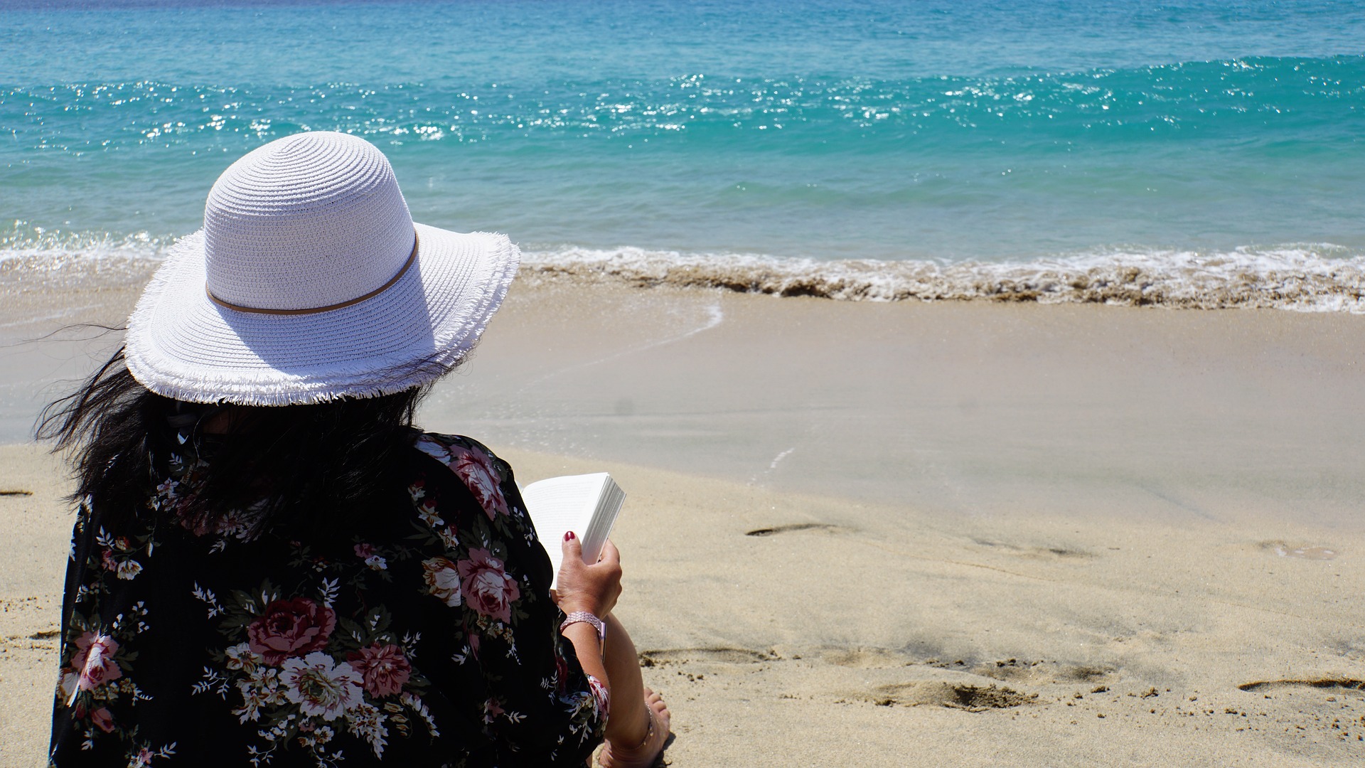 A thalassophile at the beach admiring the beauty of the Caribbean sea