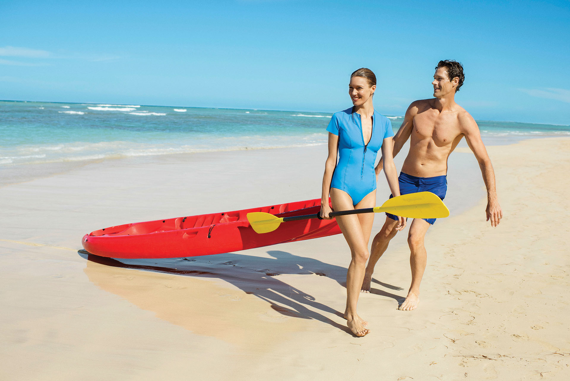 Couple enjoying ocean activities on their honeymoon Couple enjoying ocean activities on their honeymoon