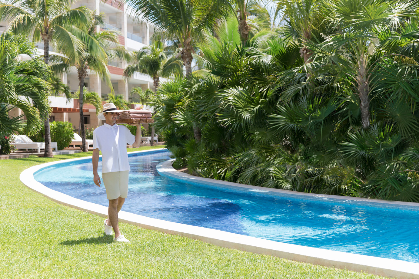 Lush gardens and lazy river at Excellence Playa Mujeres
