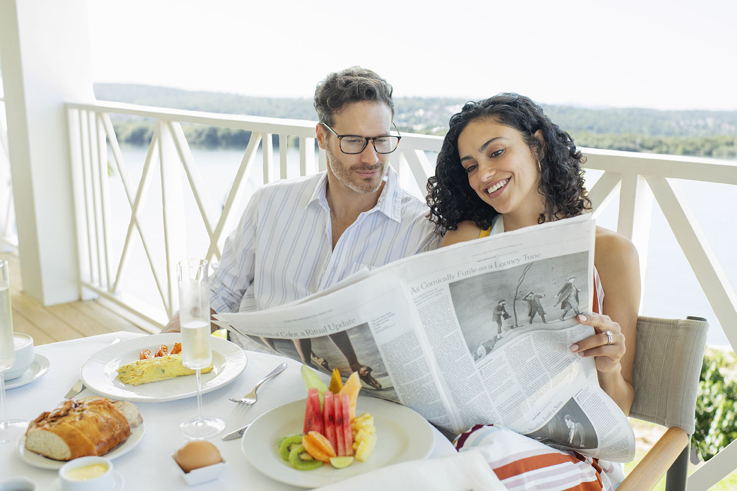 Man and woman reading a newspaper in Jamaica's low season