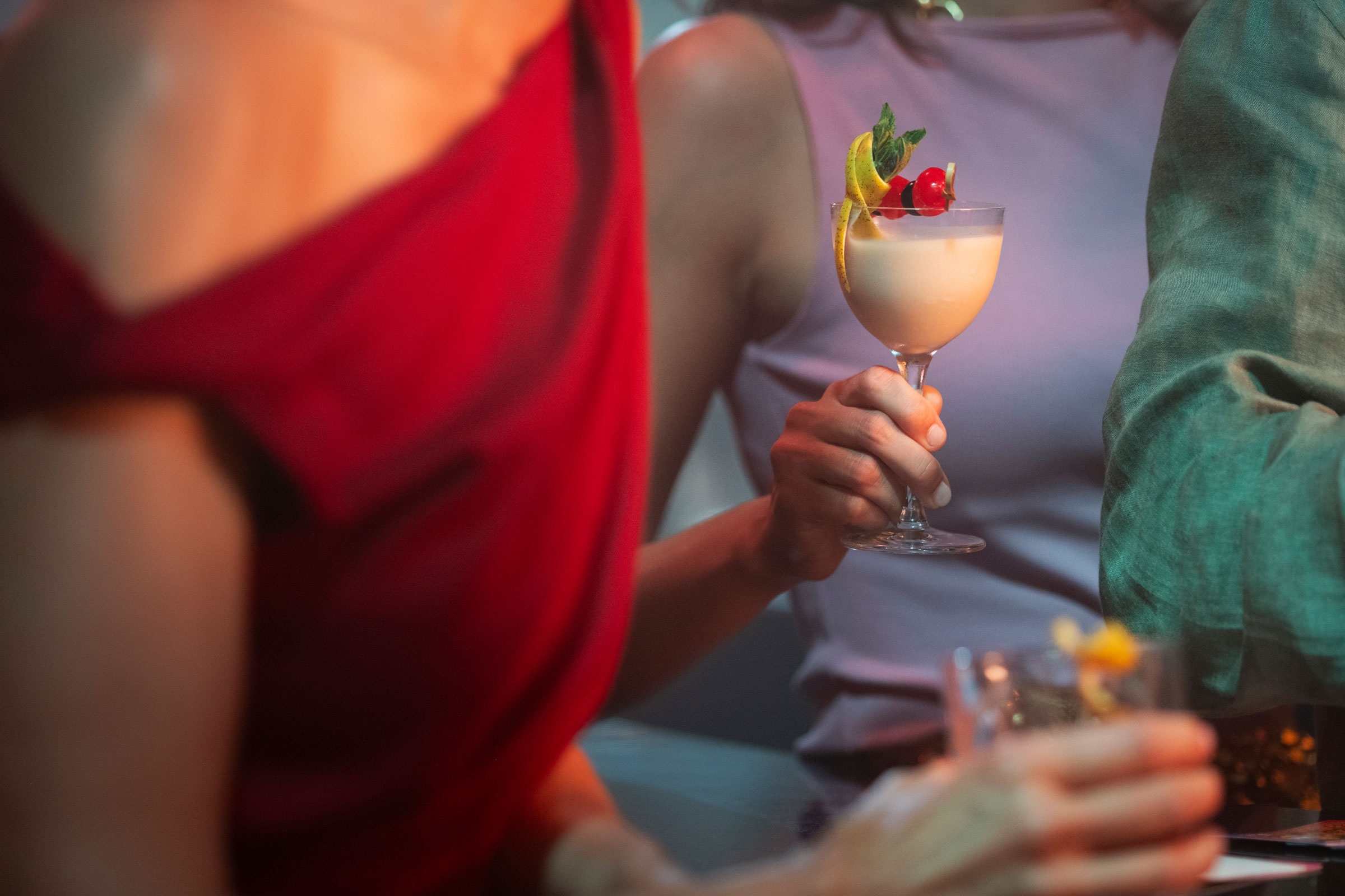 People sharing drinks in a speakeasy bar in cancun People sharing drinks in a speakeasy bar in cancun